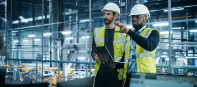 Two engineers working in a water refinery.